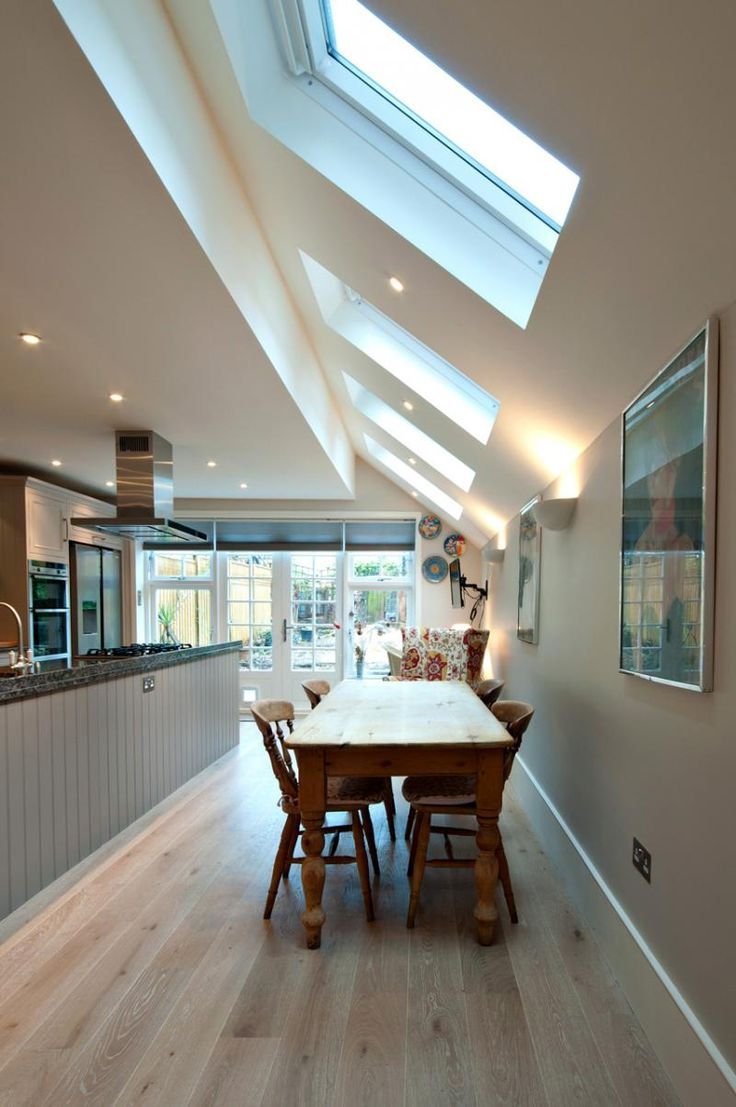 Large open plan kitchen built in Wandsworth with side and rear (wrap around) kitchen extension. Velux rooflights flooding kitchen / diner with natural light.