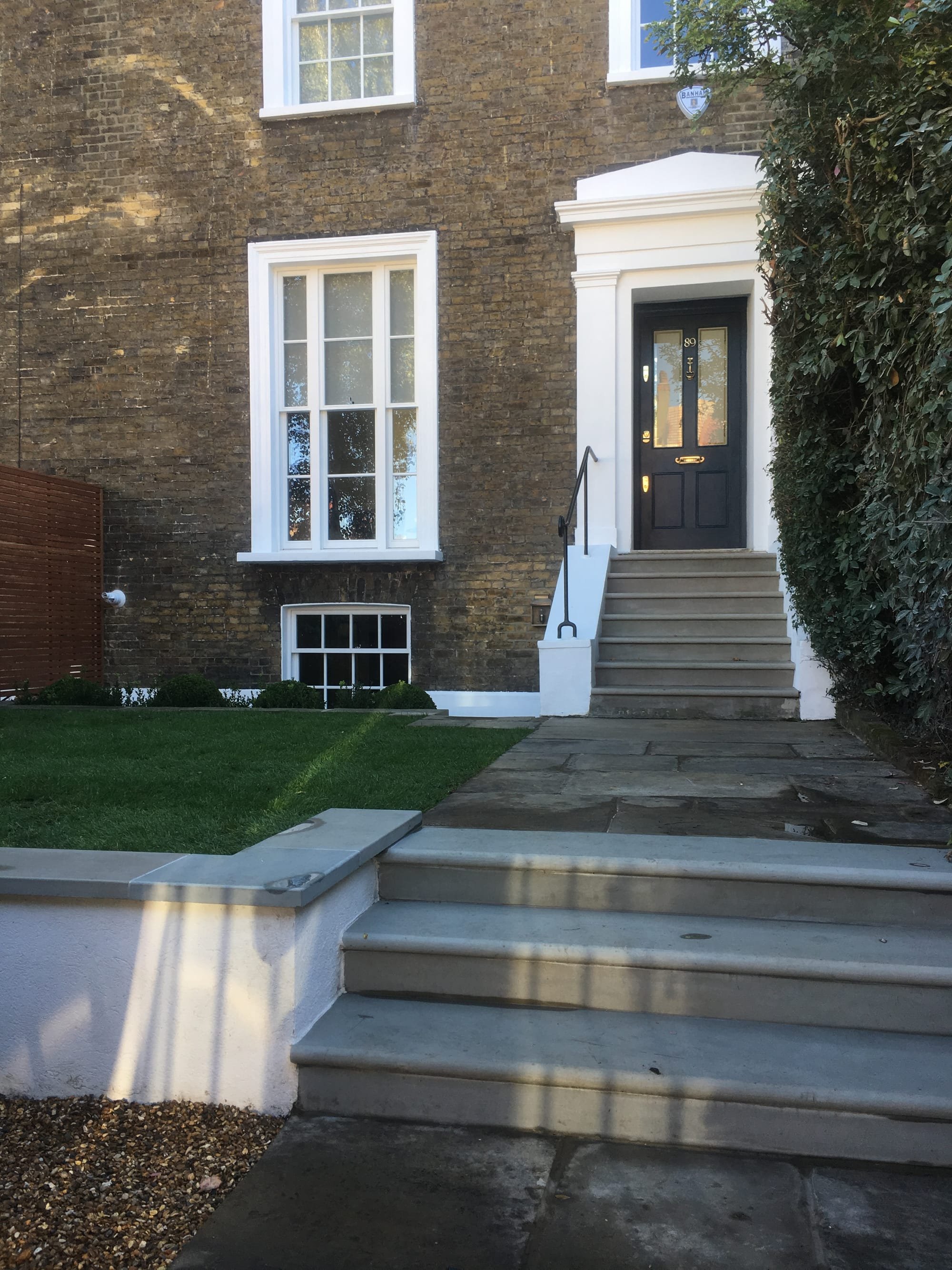 Front garden redesigned and new stone step treads - Clapham SW4 builders