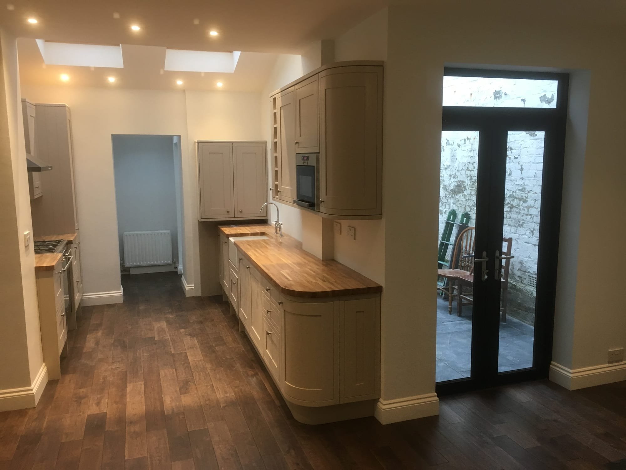 Rear kitchen extension and cloakroom with new French doors and new flooring throughout ground floor in Wandsworth, Balham, SW12