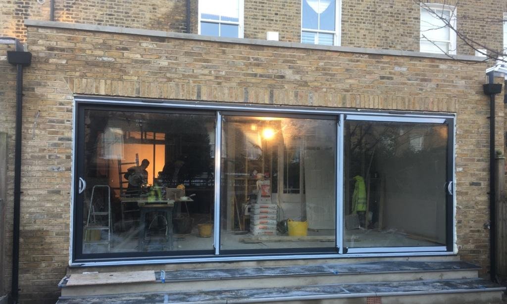 Sliding doors installed in this Wandsworth SW18  kitchen extension.