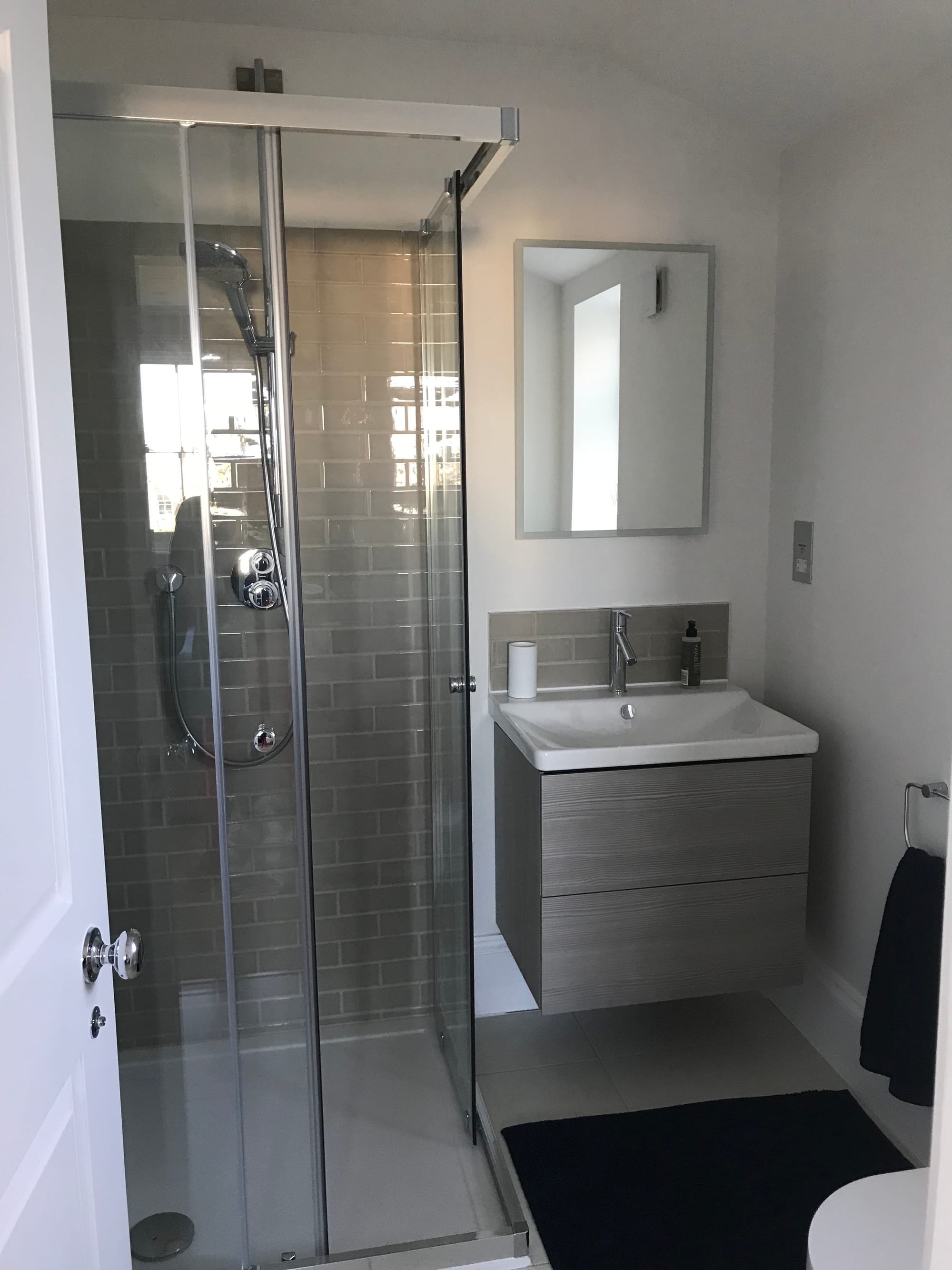 Careful planning and pocket doors can be used to convert the smallest of spaces into rooms. Like this en-suite shower room in wandsworth SW12 rear addition loft conversion extension.