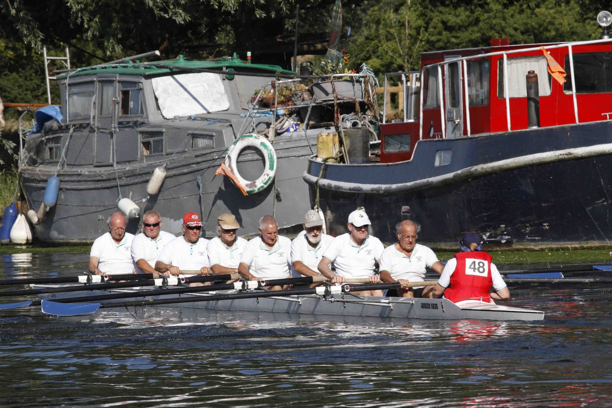 The Veterans team row down to the start