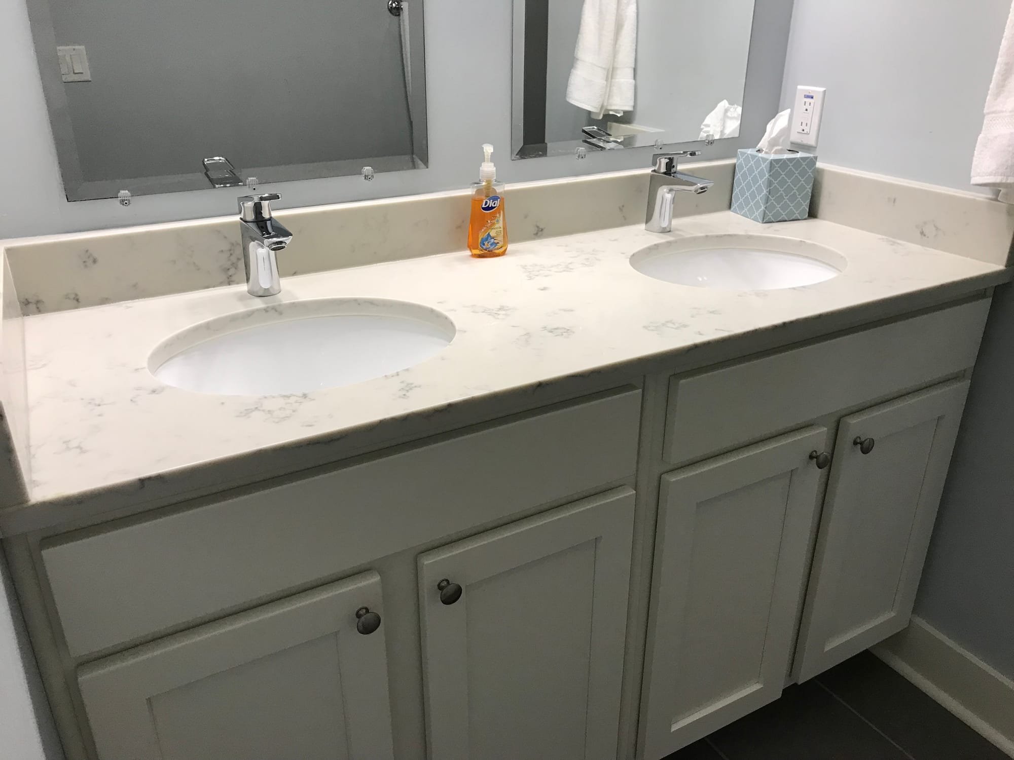 Hallway full bathroom with double vanity