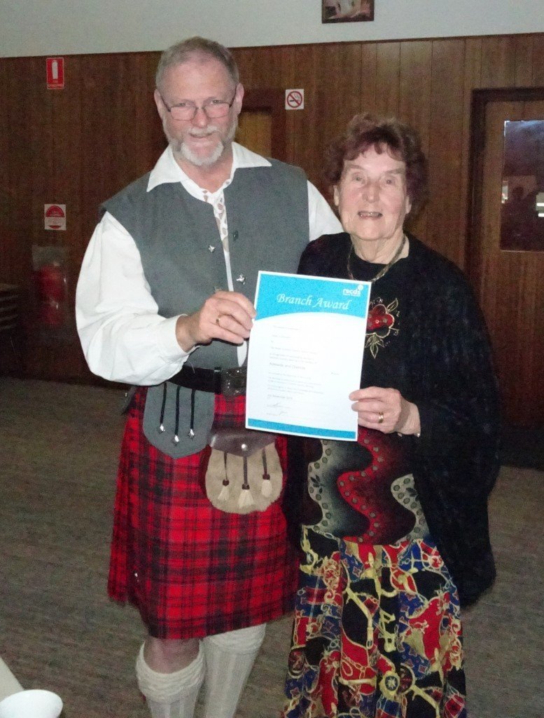 Jean Lumsden receiving her award from the President