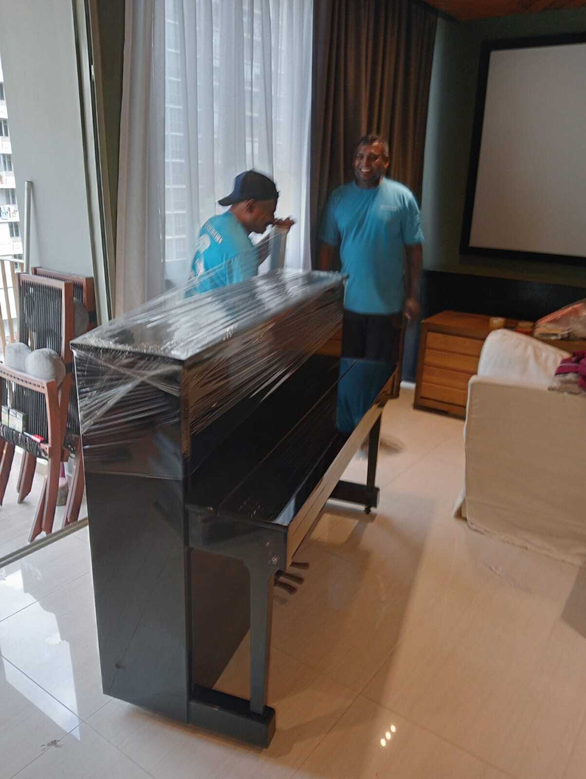 wrapping a piano for delivery