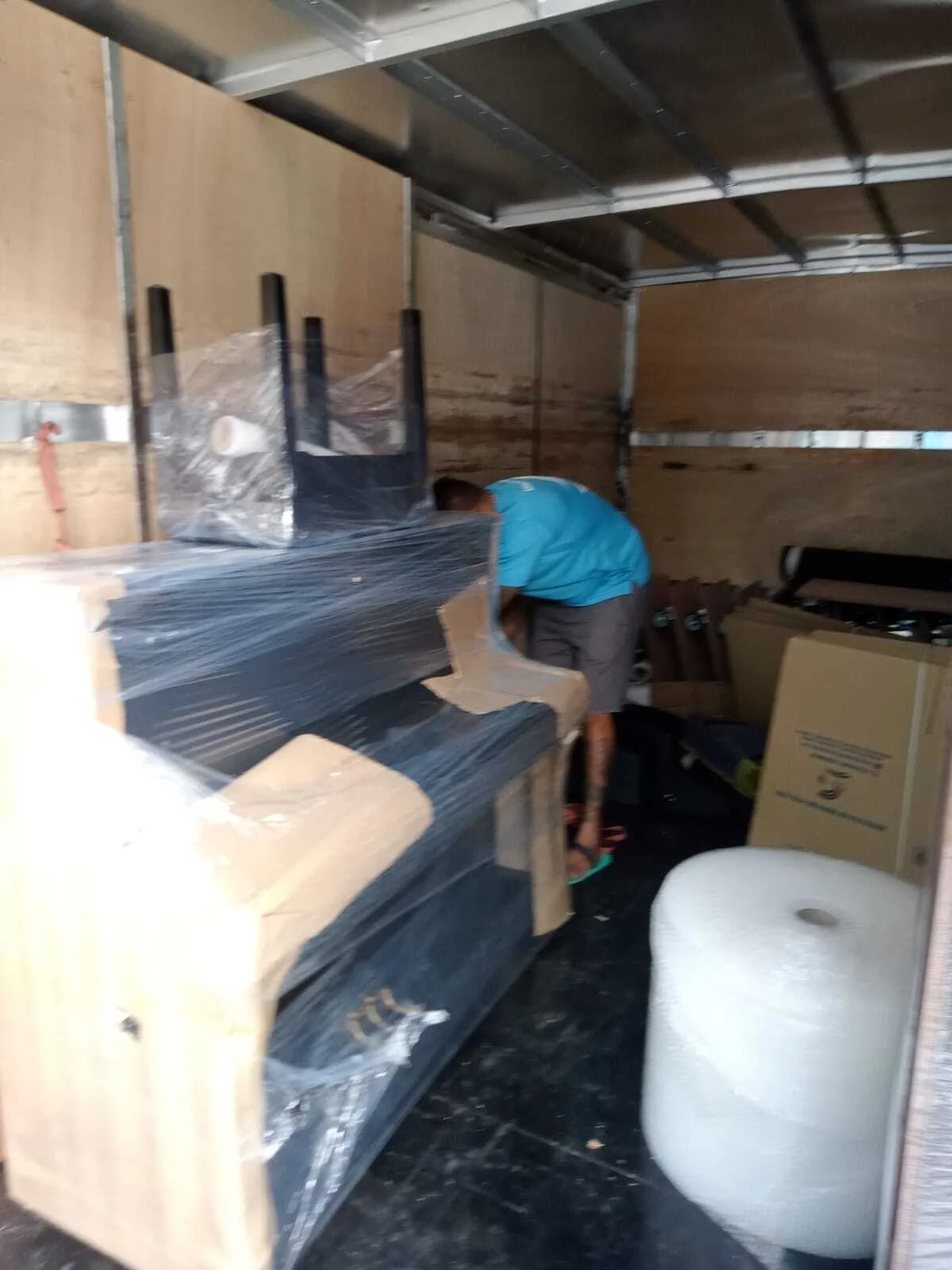 loading grand piano into truck