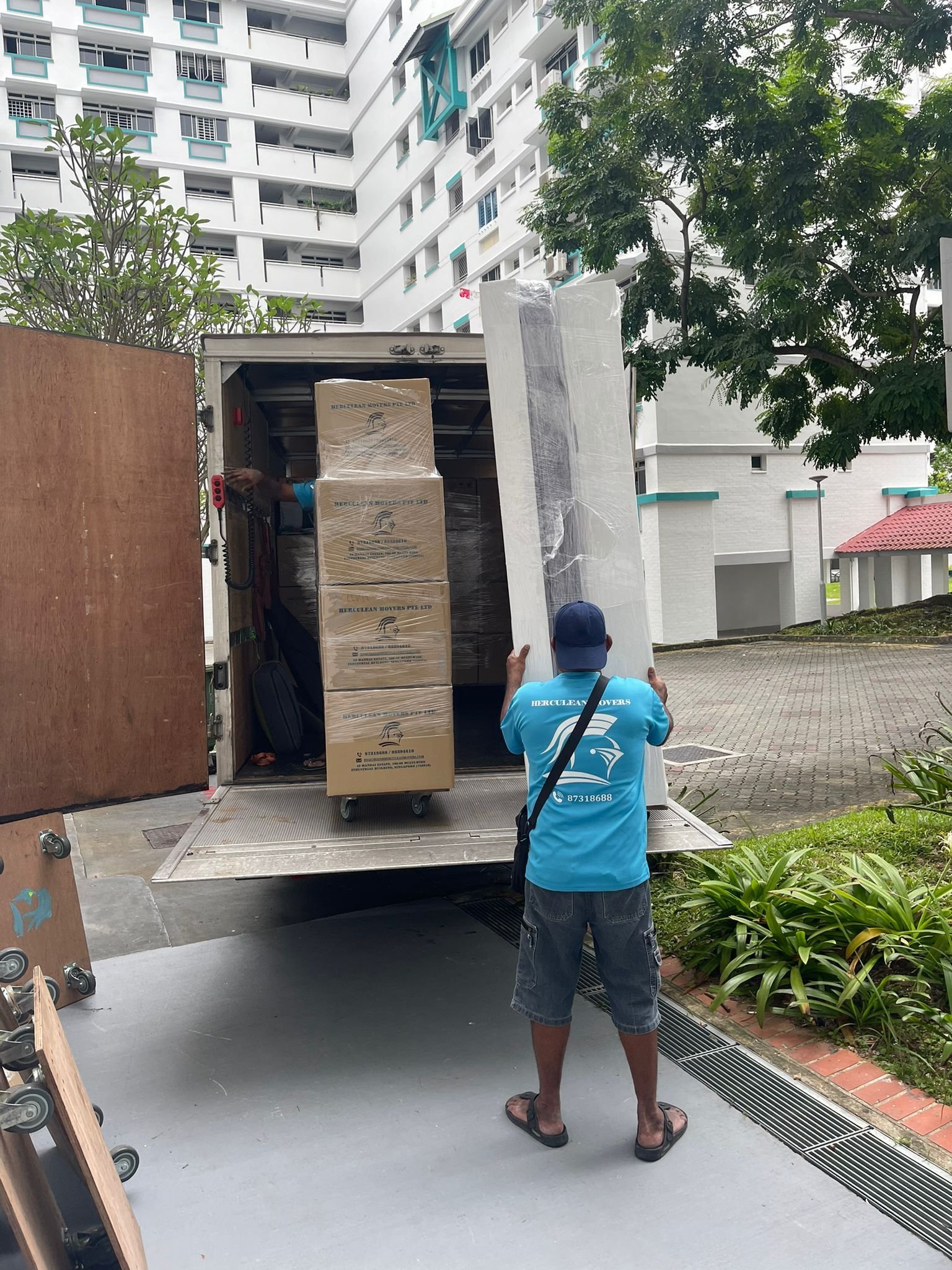 loading mattress into moving truck