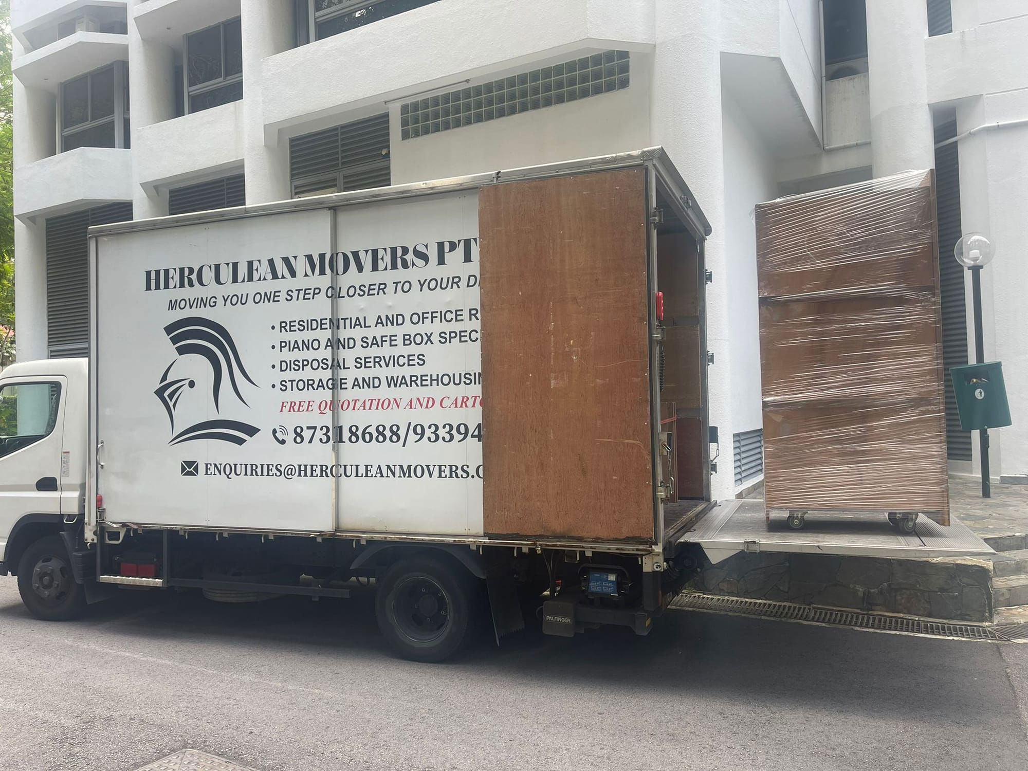 loading boxes on trolley into truck