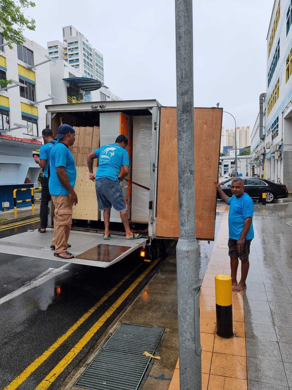 movers securing furnitures in truck