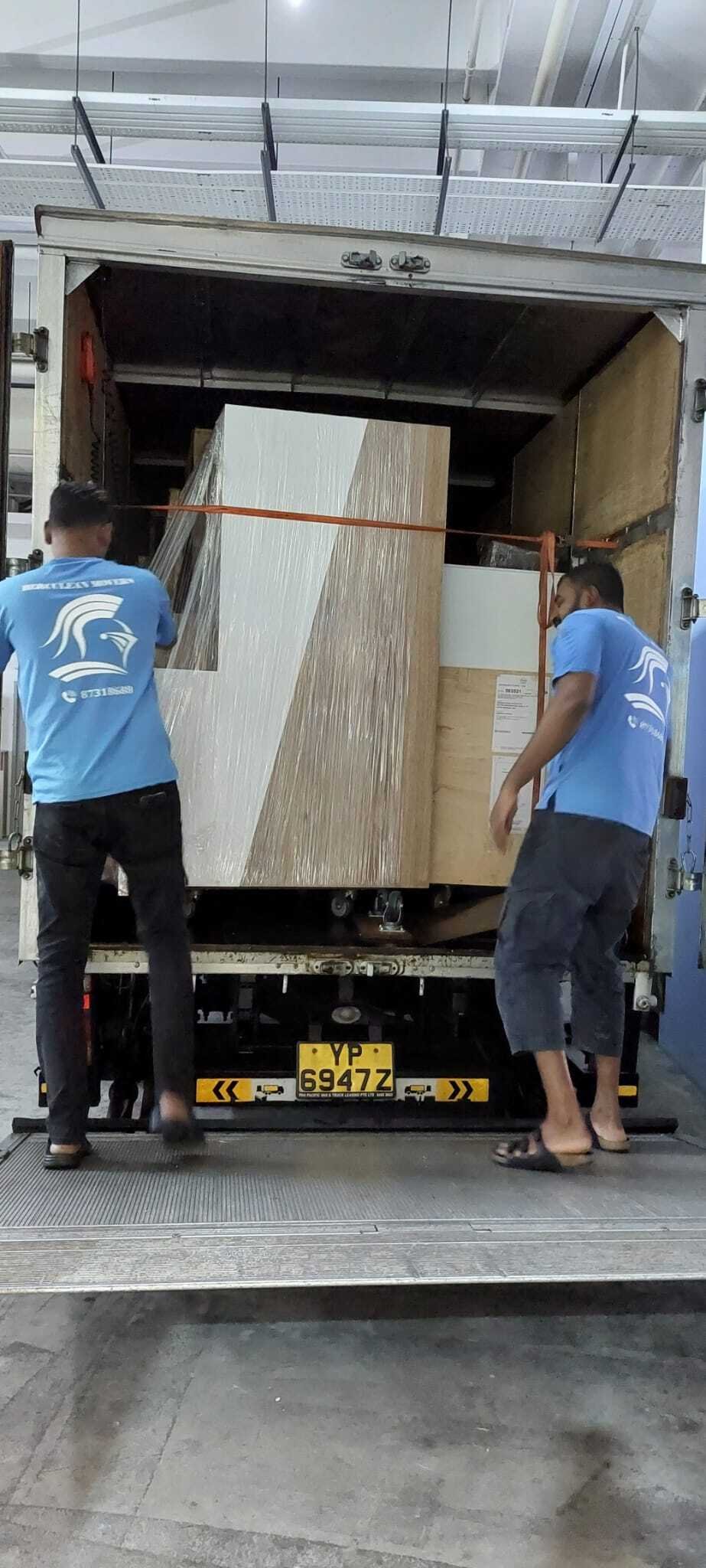 movers securing furniture before departure