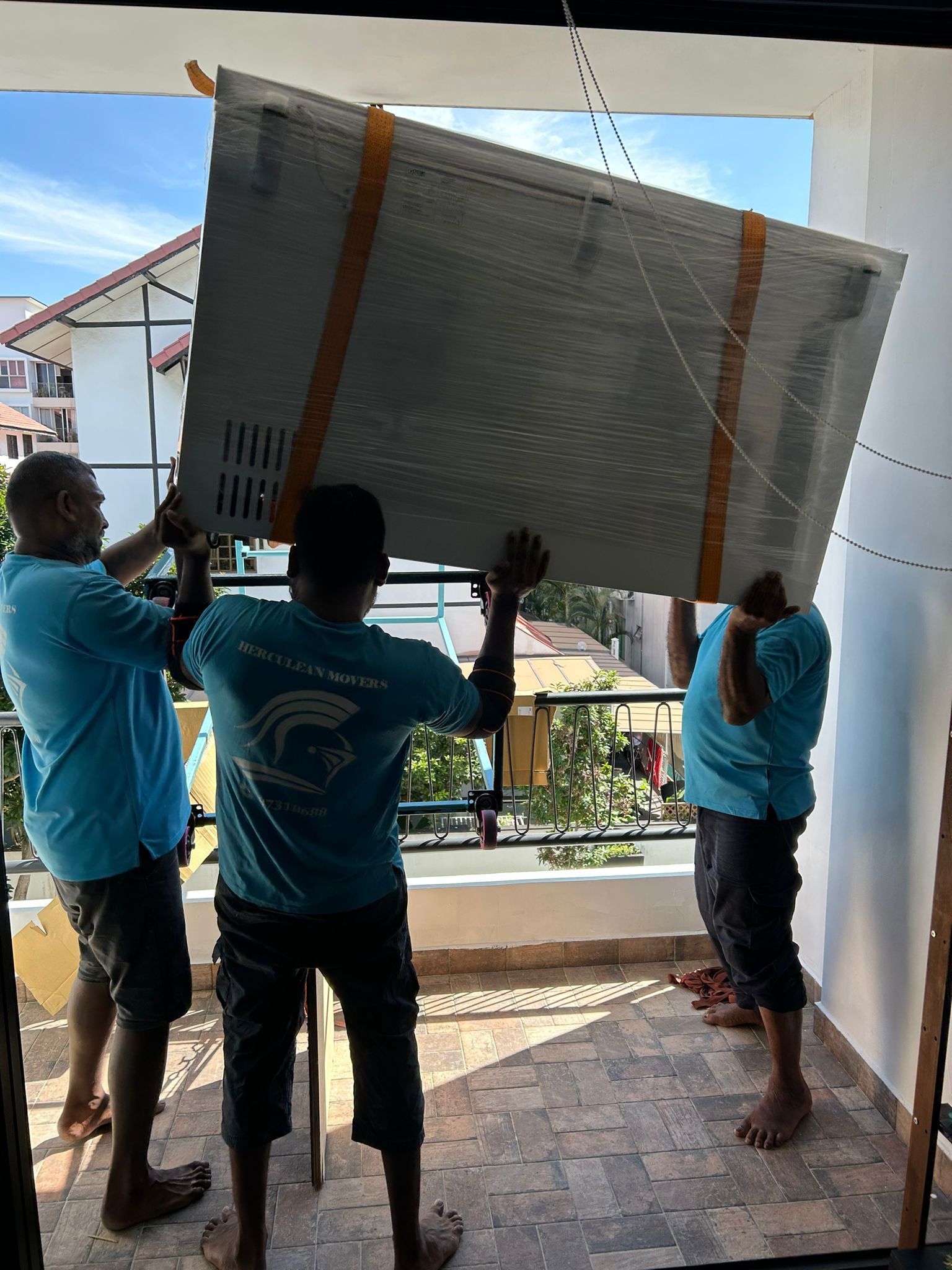 movers carrying fridge