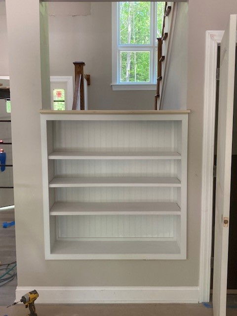 staircase with built-in bookcase