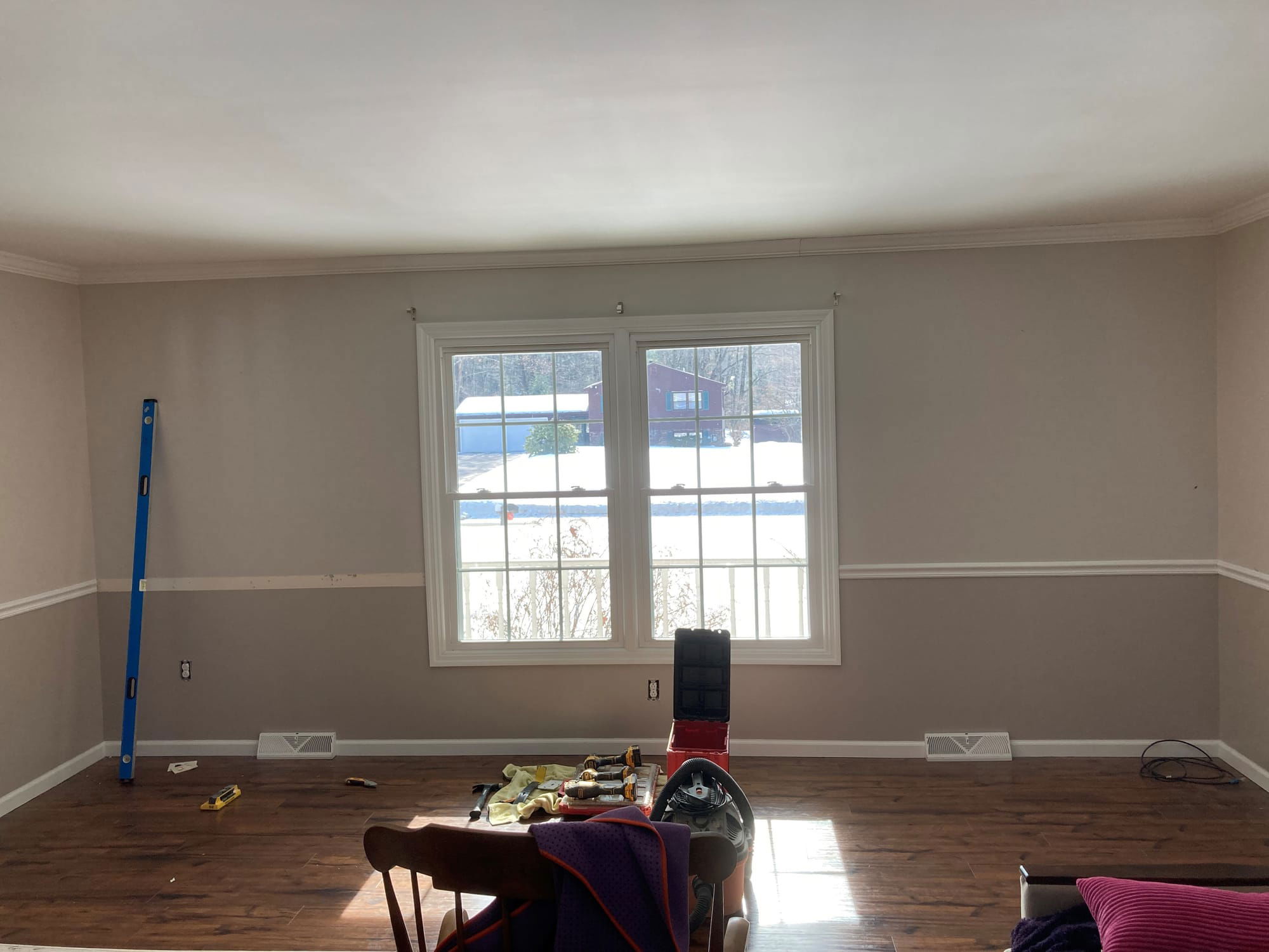 Custom bookcase and window bench with storage before