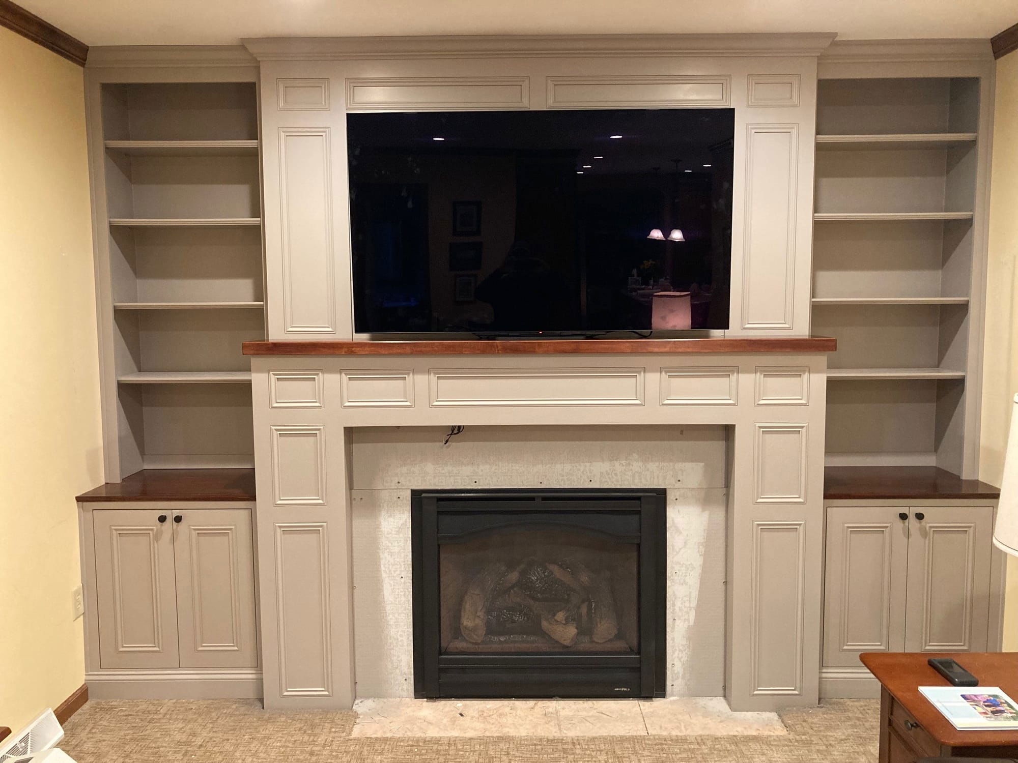 custom fireplace surround with cabinets after