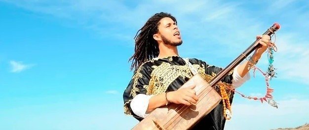Omar Afif  |  Combining the sounds of Morocco, mixed with African, jazz and other influences, Gnawa Trance Fusion is led by gimbri player and singer, Omar Afif  |