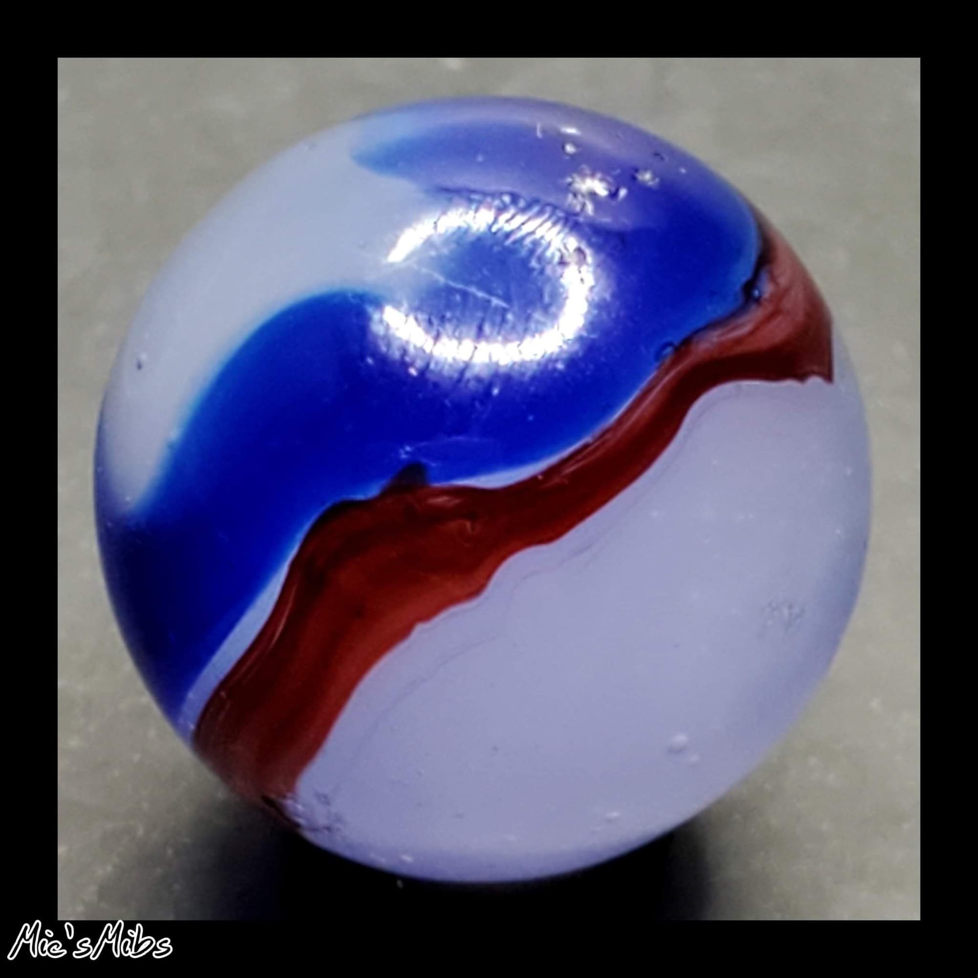 $75 5/8" Akro Blue Oxblood Swirl NM/-