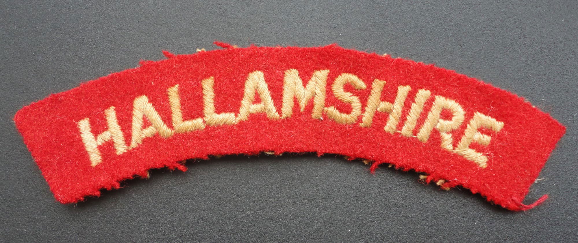 Hallamshire Cloth Shoulder Title-red background