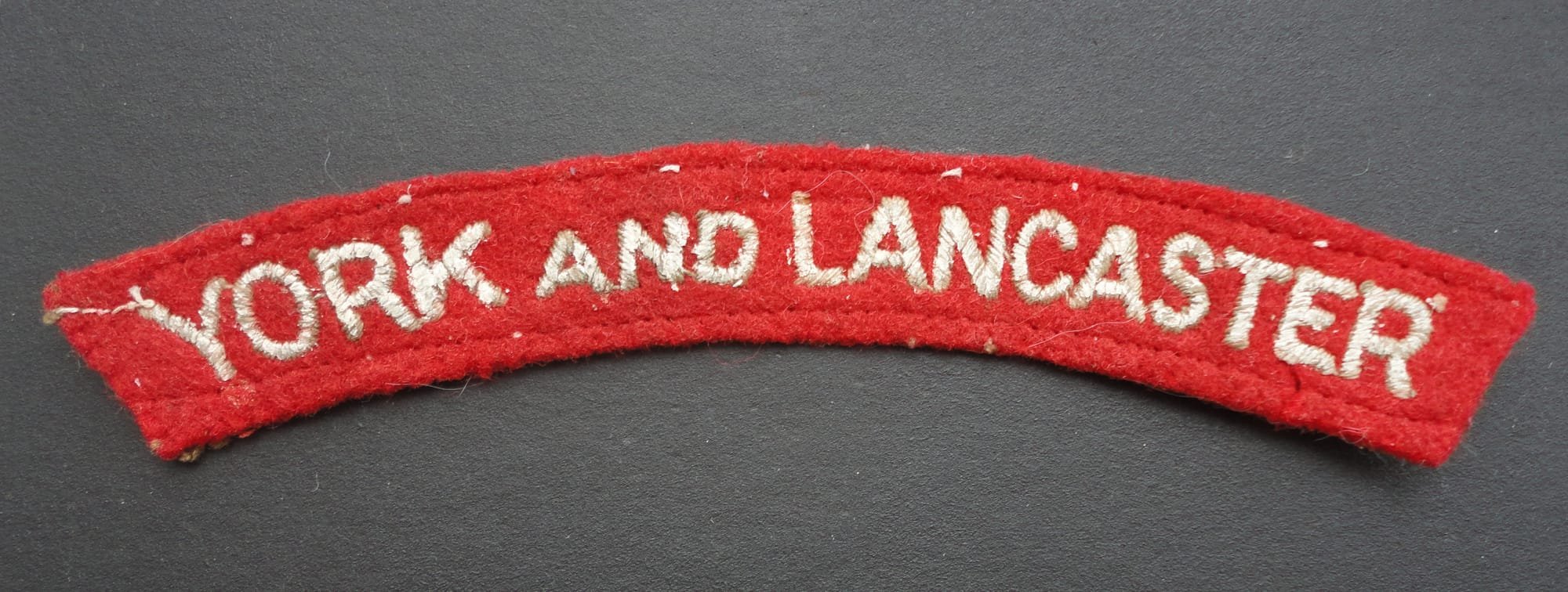York and Lancaster Cloth Shoulder Title-Red Background Whitened Lettering