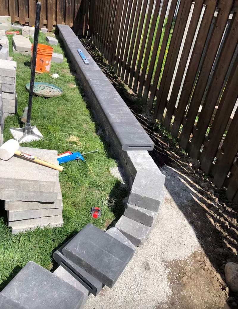 interlock installation back yard retaining wall with coping KYK