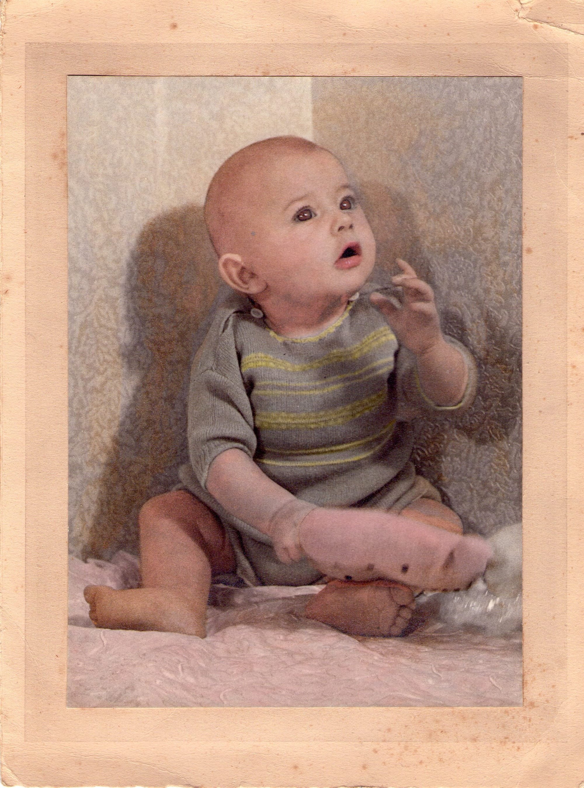 A b&w photo of Paul, hand coloured by his Granddad