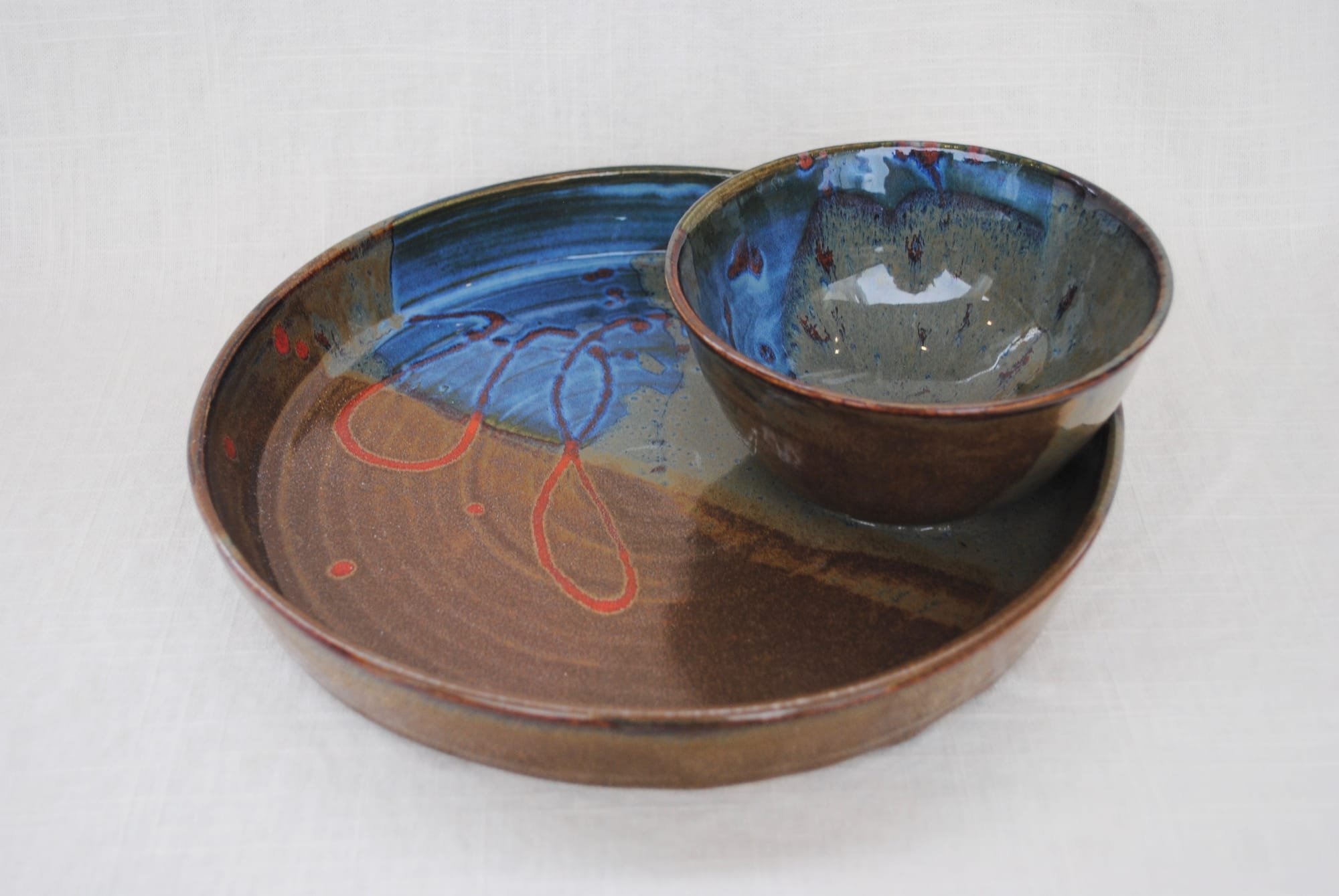 Serving tray with attached bowl