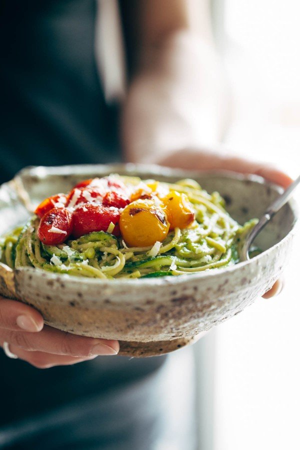 Tomato zoodles tossed with a creamy avocado sauce.